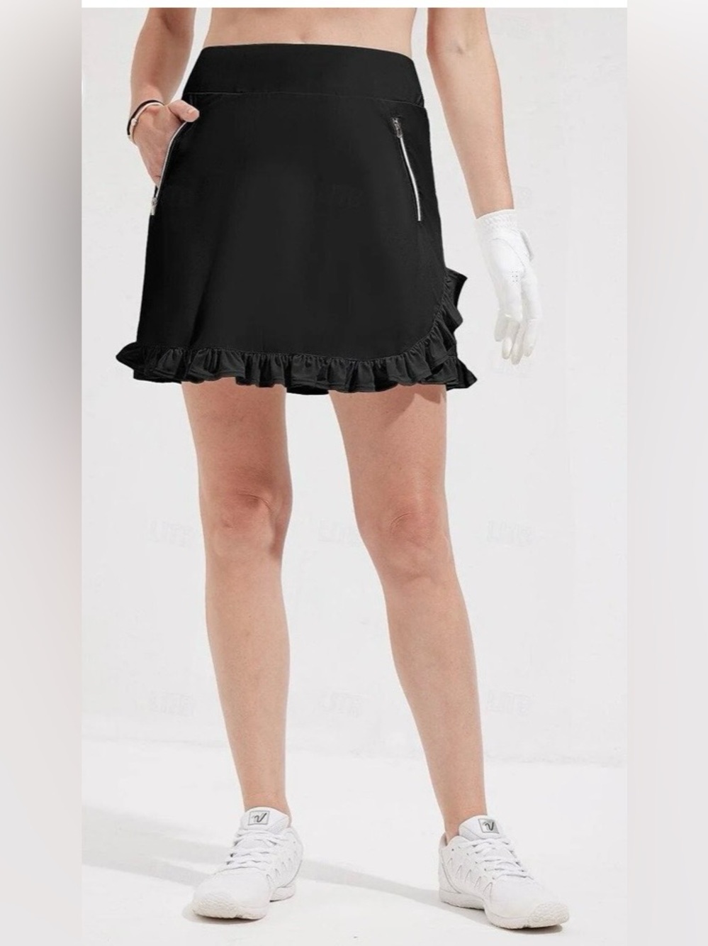 ÅCEGOLFS Ruffle-Hem Black Mini Skirt with Zip Pockets